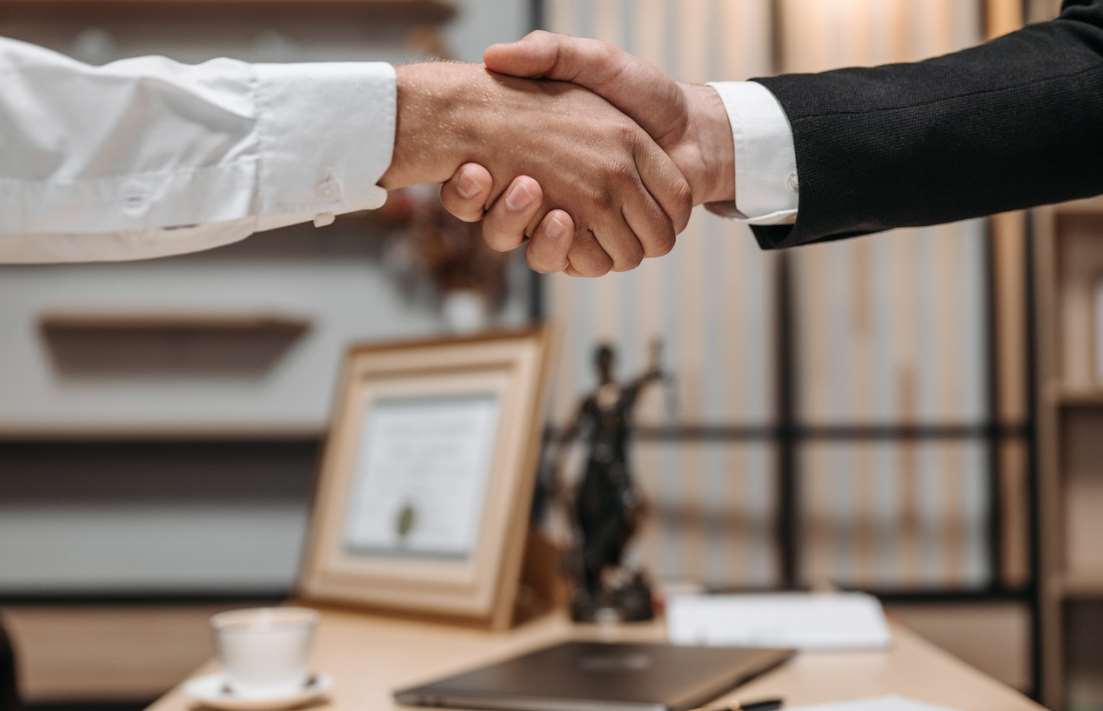 Client and Lawyer Shaking Hands